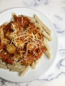Vegan Pasta and "Meatballs" Dish using ShroomEats meatballs, Violife shredded cheese, and Not Just Co. pasta sauce- All for purchase on GTFO It's Vegan!